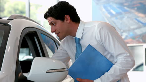 Businessman-checking-out-a-car