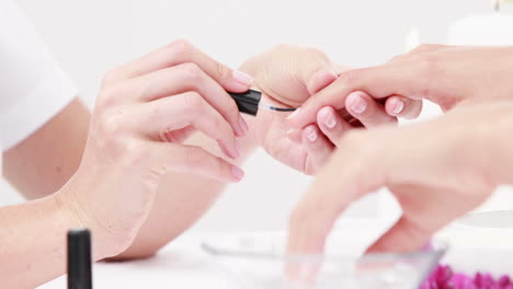 Woman-getting-a-manicure-at-nail-salon
