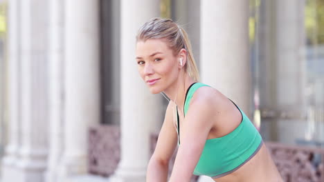 Pretty-blonde-jogger-stretching