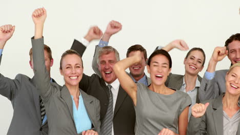 Business-people-cheering-in-front-of-camera-