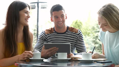 Students-working-on-assignment-at-campus-cafe