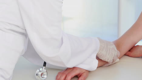 Doctor-examining-her-patients-wrist