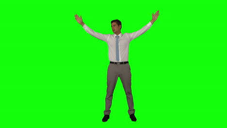 Businessman-standing-with-arms-raised