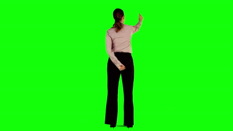 Businesswoman-interacting-with-green-screen