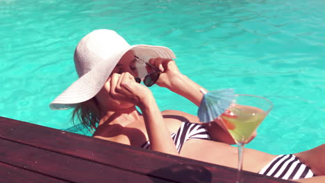 Attractive-woman-relaxing-on-lilo