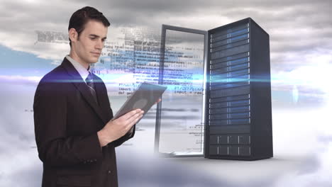 Businessman-using-tablet-computer-in-front-of-server-tower-on-sky-background