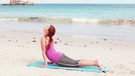 Woman-stretching-her-body-on-the-beach
