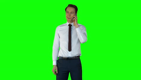 Businessman-having-phone-call-on-green-screen-