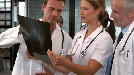 Medical-team-looking-at-x-ray-during-a-meeting