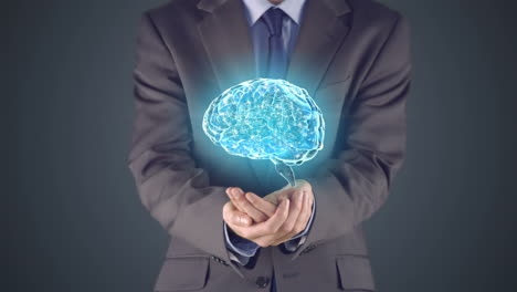 Businessman-presenting-brain-with-hands