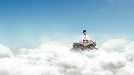 Businessman-using-tablet-in-the-clouds