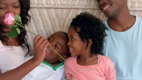 Happy-family-having-breakfast-in-bed