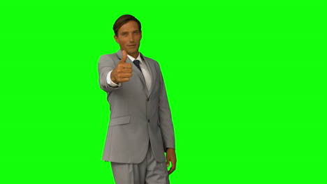 Businessman-gesturing-thumbs-up