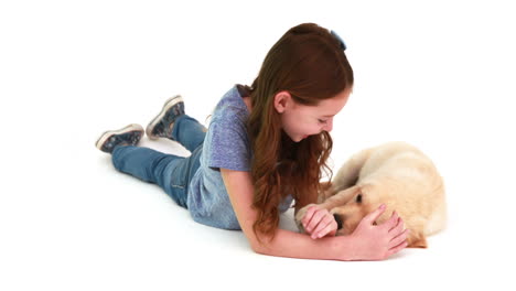 Smiling-girl-playing-with-cute-puppy