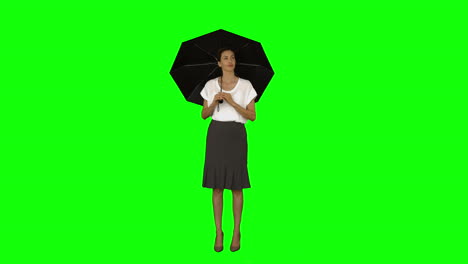 Businesswoman-standing-under-a-umbrella