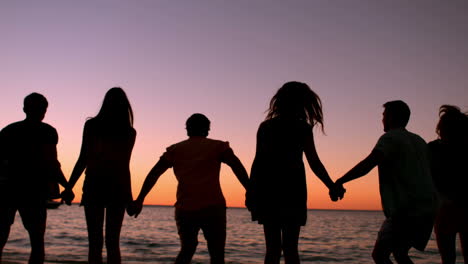 Friends-jumping-at-the-beach