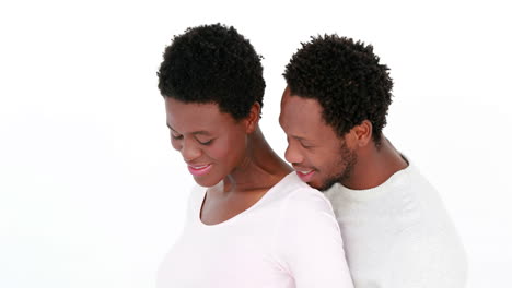 Pregnant-woman-and-husband-with-arms-around