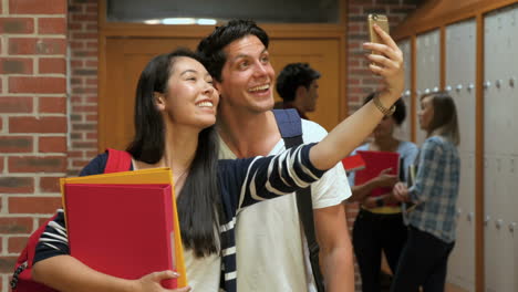 Two-smiling-students-taking-a-selfie