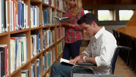 Disabled-student-reading-in-the-library