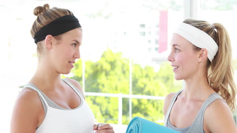 Smiling-athletic-women-discussing-together