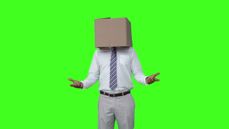 Businessman-with-box-over-head-and-shrugging