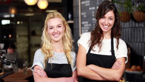 Smiling-co-workers-with-thumbs-up