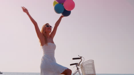 Pretty-blonde-woman-having-fun-on-bike