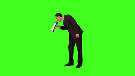 Businessman-standing-and-shouting-with-megaphone