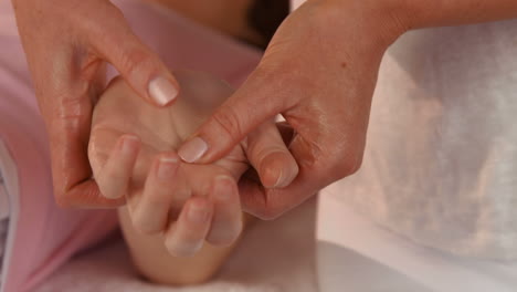 Woman-enjoying-a-hand-massage