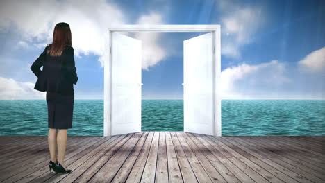 Door-opening-to-ocean-watched-by-businesswoman
