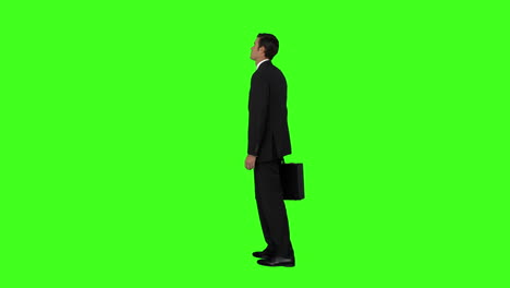 Businessman-standing-with-his-briefcase