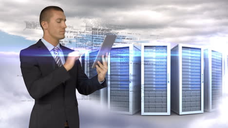 Businessman-using-tablet-computer-in-front-of-servers-towers-on-sky-background