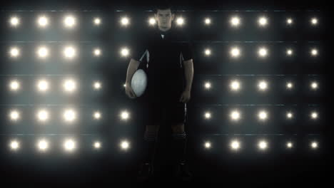 Serious-rugby-player-holds-rugby-ball