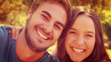 Close-up-of-happy-couple-taking-selfie-in-the-park