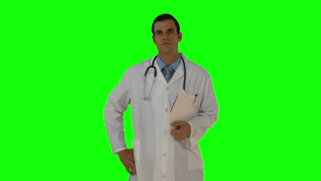 Young-doctor-standing-and-looking