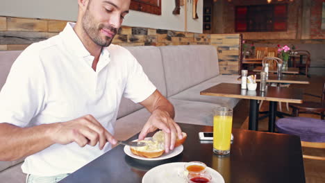 Happy-man-buttering-his-bread-