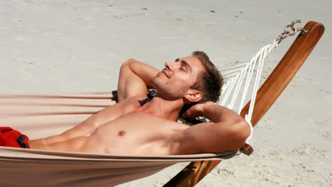 Handsome-man-relaxing-on-his-bed