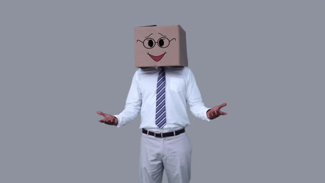 Businessman-hiding-head-with-happy-box