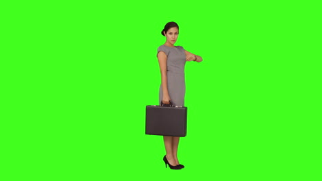 Businesswoman-standing-checking-the-time