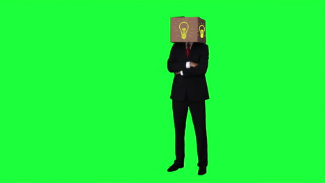 Businessman-hiding-head-with-box-with-light-bulb