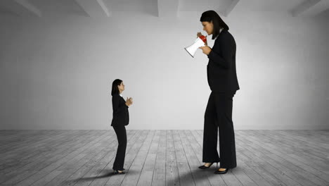 Giant-female-boss-yelling-on-scared-businesswoman-with-megaphone