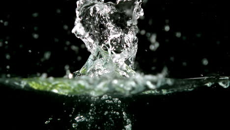 Cucumber-slices-falling-in-water