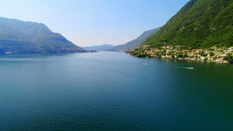 Green-lush-mountain-and-lake-on-a-sunny-day-4k