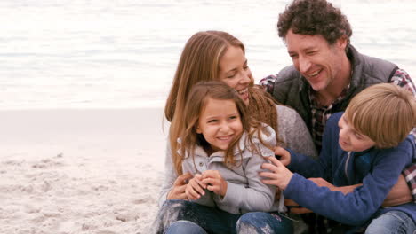 Family-sitting-and-hugging-each-other