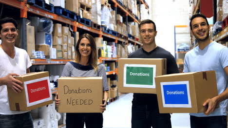 Men-and-woman-carrying-donation-box