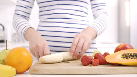 Close-up-on-a-woman-carving-some-fruits