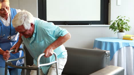 Nurse-helping-retired-man-with-walker