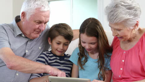 Grandparents-and-grandchildren-using-tablet