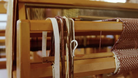 Close-up-of-hand-loom-machine-in-a-empty-workshop-4k