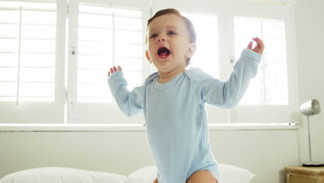 Cute-baby-jumping-on-a-bed